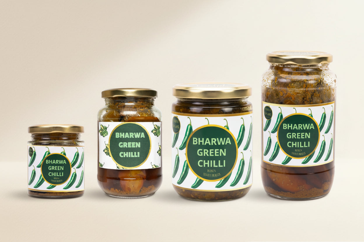 Four jars of Bharwa Green Chilli on a white background